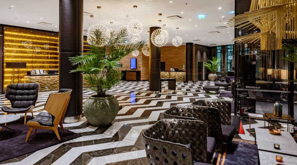 Chandeliers and seating area in the lobby at the Clarion Hotel Helsinki Airport