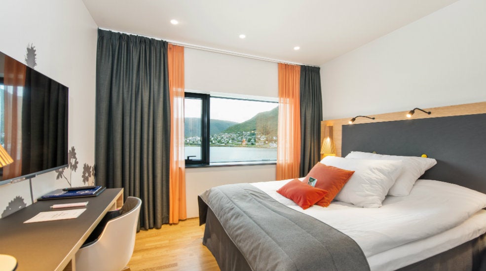 Enjoy the amazing view of the fjord from this elegant double hotel room at The Edge Hotel in Tromso