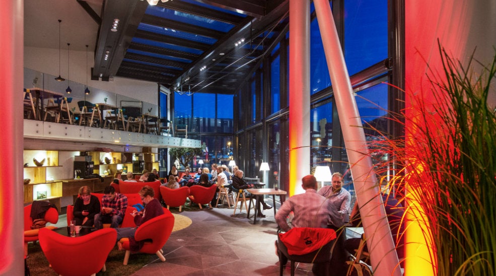 Vibrant hotel lobby area at The Edge Hotel in Tromso