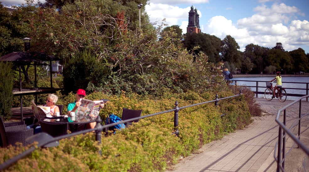 Tranquil garden and relaxation by the river at Bolinder Munktell Hotel in Eskilstuna