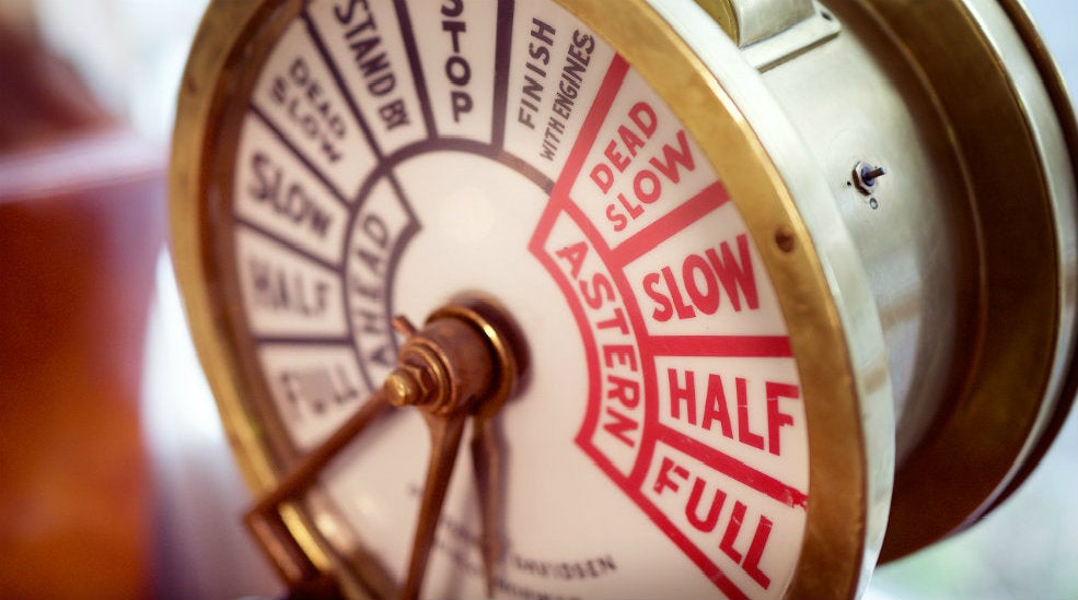 The interior design includes a rustic maritime engine wheel at With Hotel in Tromso