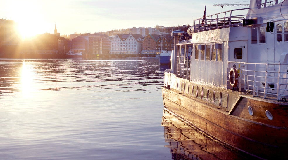 Boat and the harbour located at With Hotel in Tromso